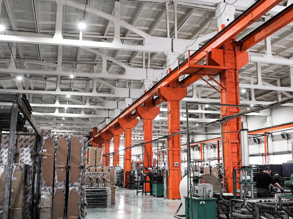 very well lit factory with orange gantry and LED Commercial Lighting